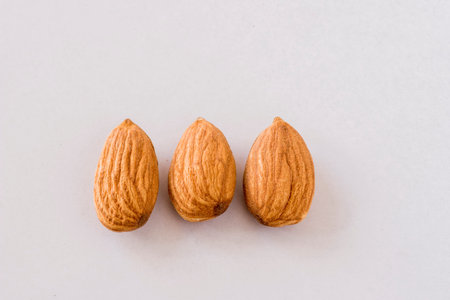 Almonds on white background