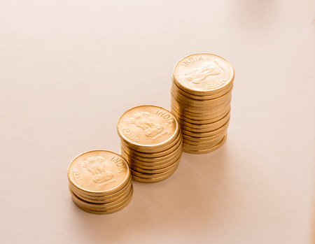 Pile of Indian coins on white background