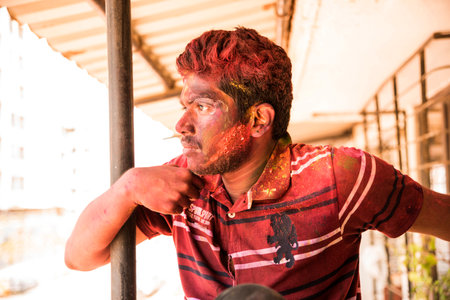 MUMBAI, MAHARASHTRA, INDIA- March 16: A young boy smiling after holi celebration, the Indian festival of colours, on March 16, 2016 in Virar, Mumbai, Maharashtra, India.のeditorial素材