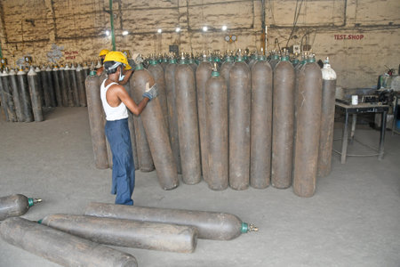 Burdwan, West Bengal (India) - 29.04.2021: Medical oxygen refilling in cylinders is underway at the Oxygen Refilling Center to meet the oxygen needs of patients infected with COVID-19 (Coronavirus).のeditorial素材