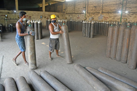 Burdwan, West Bengal (India) - 29.04.2021: Medical oxygen refilling in cylinders is underway at the Oxygen Refilling Center to meet the oxygen needs of patients infected with COVID-19 (Coronavirus).のeditorial素材