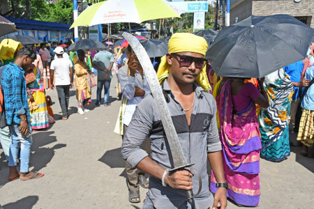 Burdwan Town, Purba Bardhaman District, West Bengal (India) - 07.07.2022: Indigenous people blocked roads in Burdwan with traditional weapons in multiple demands.のeditorial素材