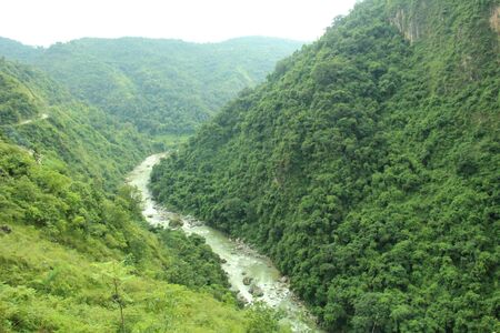 Natural river flowing from Himalaya at rainy season, Nepal beautyの写真素材