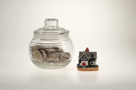 jar with coins and houseの写真素材