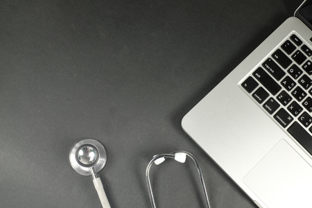 Medical stethoscope on a laptop computerの写真素材