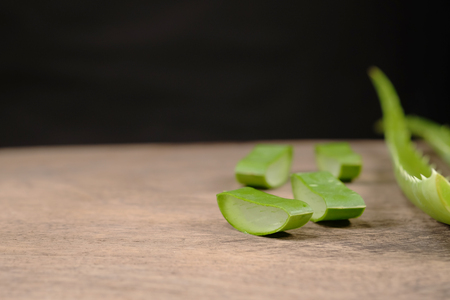 aloe sliced, isolated on a wooden backgroundの写真素材