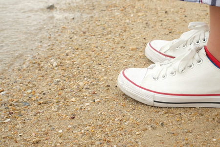 shoes on tropical sand beach texture background, copy space of travel adventure concept.の写真素材