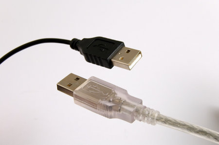 Detail of black and white USB connectors isolated on white