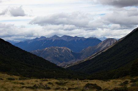 View from Cass saddle towards Cass valley, orange tramping track markers, Craigieburn Forest Park near Arthur's Pass, Southern Alps, New Zealandの写真素材
