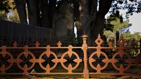 Decaying rusty grave fenceの写真素材