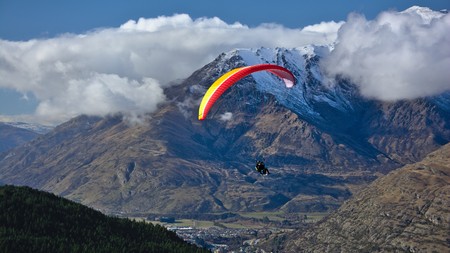 Tandem paraglider, Frankton, and Remarkables ski field access road, Queenstown, Otago, New Zealandの写真素材