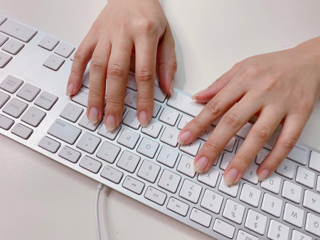 Female hands or woman office worker typing on the keyboard