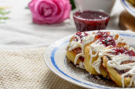A delicious dessert with tea and coffee. The mood is bright , sunny, romantic.