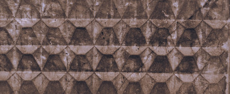 Texture of light brown old concrete fence with scuffs and cracks. Wallpaper design with convex...