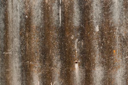 Rustic gray concrete texture with lichen and mold. Wallpaper of old stone with rust.