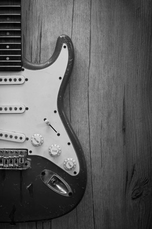 Ole electric guitar on old wood background : Black and Whiteの写真素材