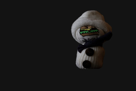 Snow man made from a white sock against gray background. Global warmingのeditorial素材
