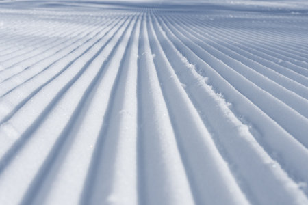 Preparations for the start of the ski season, grooming the pistes for skiers.の写真素材