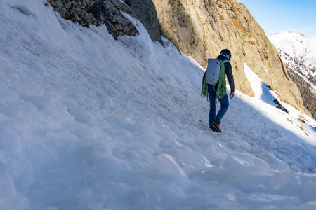 Man walking across icy avalanche debris in the French Alps.の写真素材