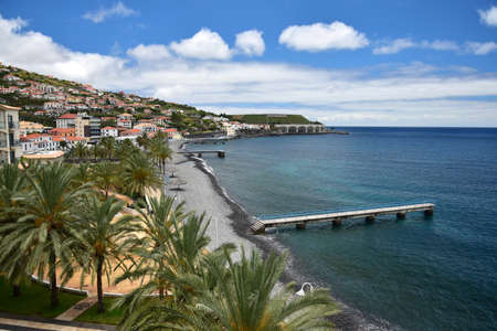 Santa Cruz, a beautiful small coastal town at Madeira, with the beach and the bathing stages. Portugal.の写真素材