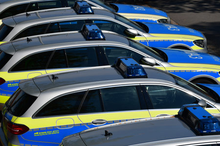 Several marked police cars in Germany standing side by side. Top view.のeditorial素材