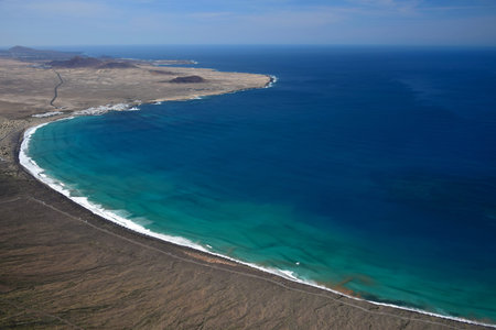View from Mirador del Bosquecillo down to Famara and Famara beach. Lanzarote, Spain.