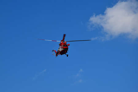 The rescue helicopter from the High Tatras and a blue sky. Slovakia - Poland.の写真素材