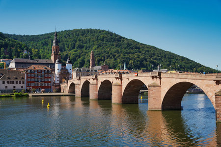 Heidelberg with the Old Bridge, river Neckar and the Bridge Gate in the morning sun. Germany.の写真素材