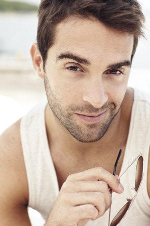 Handsome man sitting outdoorsの写真素材