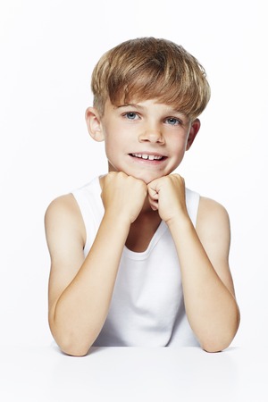 Portrait of young boy in vest, studioの写真素材
