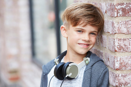 Young boy wearing headphones, close upの写真素材