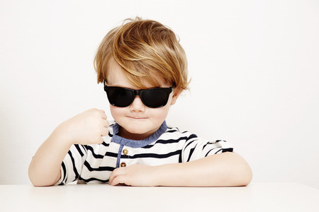 Cool young boy in sunglasses, portraitの写真素材