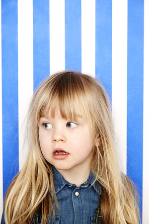 Young blonde girl looking awayの写真素材