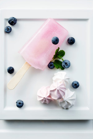 Pink ice lolly and candy dessert