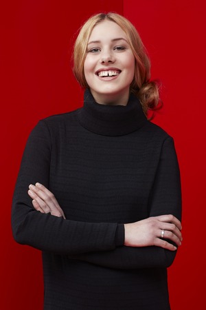 Portrait of confident woman against redの写真素材