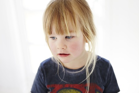 Young girl in t-shirt looking awayの写真素材