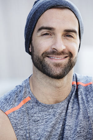 Smiling man with beard, portraitの写真素材