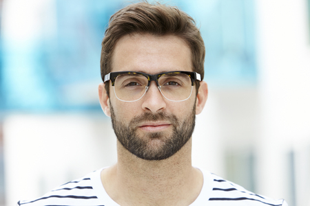 Stubble man in spectacles, close upの写真素材