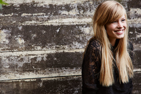 Smiling beautiful blond looking awayの写真素材