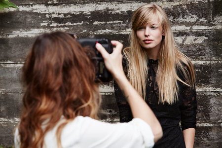 Beautiful babe posing for photographerの写真素材