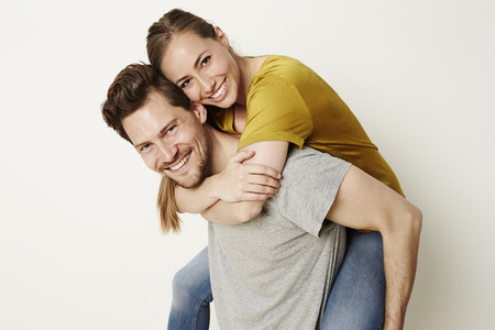 Fun couple smiling at camera, portraitの写真素材