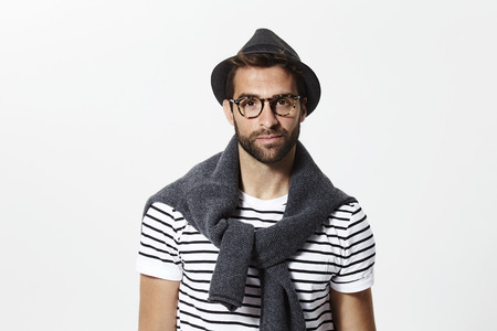 Portrait of guy in hat and specsの写真素材