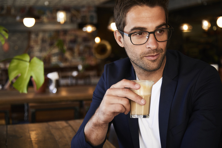 Coffee guy in cafe, looking awayの写真素材
