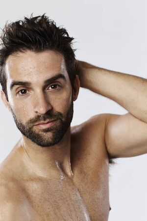 Guy sweating in studio, portraitの写真素材