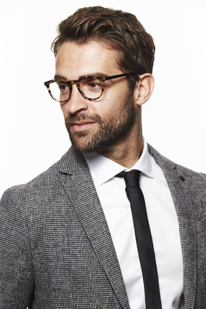 Guy in grey suit jacket, looking awayの写真素材