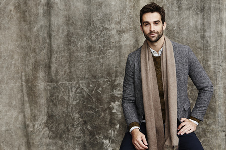 Scarf and jacket man in studio, portraitの写真素材