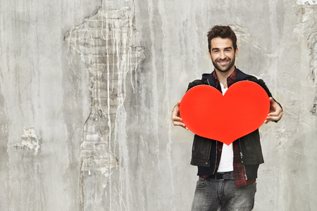 Love heart held buy dude, portraitの写真素材