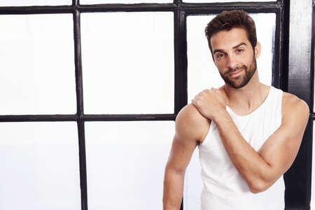 Guy in vest smiling to cameraの写真素材