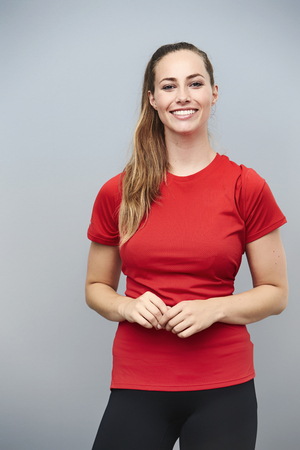 Happy athlete in red t-shirt, smilingの写真素材