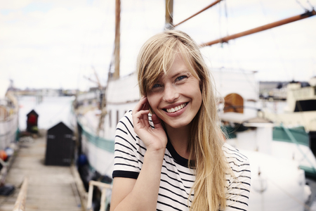 Stunning blue eyed blond woman, portraitの写真素材